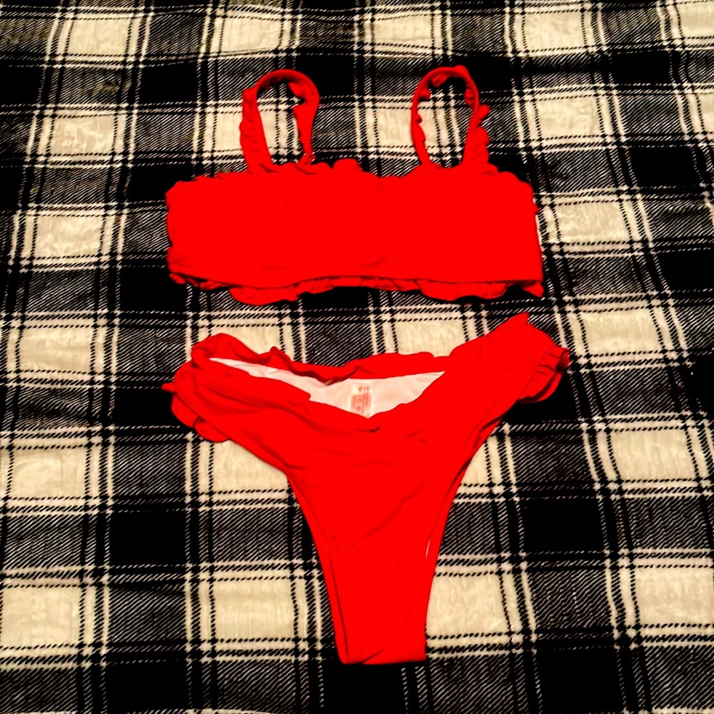A Ladies Bathing suit Med size ordered from shein never worn. Red nylon,